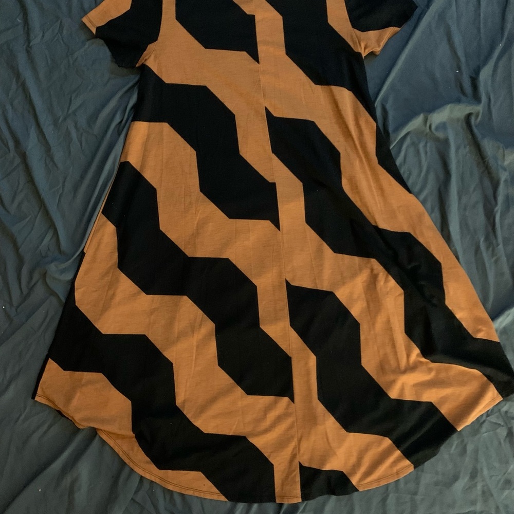 An orange and black tshirt dress. Size small. A LulaRoe design
